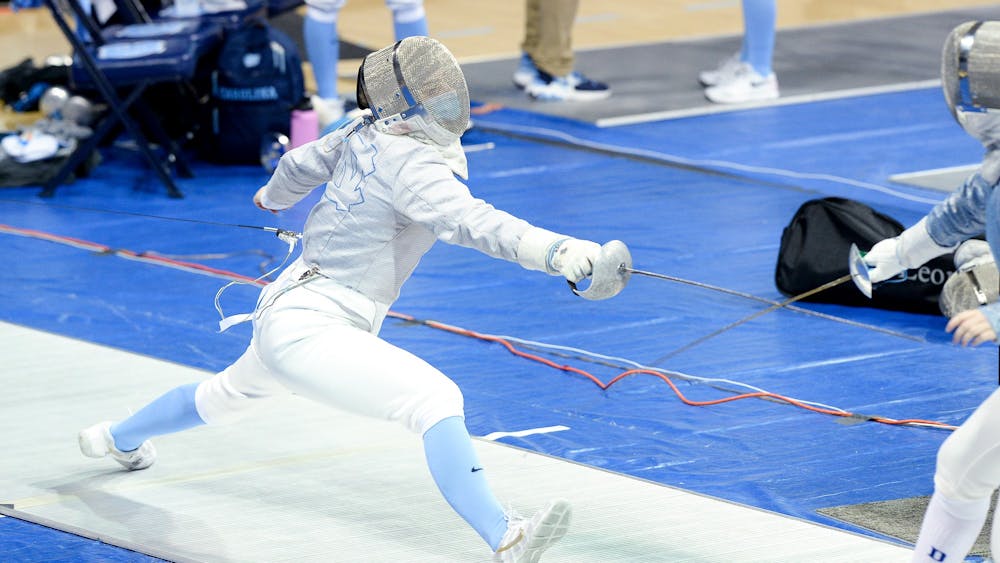 Abigale Parker fences during the  ACC Championship in Carmichael Arena on Sunday, Feb. 28, 2021.
Photo Courtesy of Jeffrey Camarati/UNC Women's Fencing.