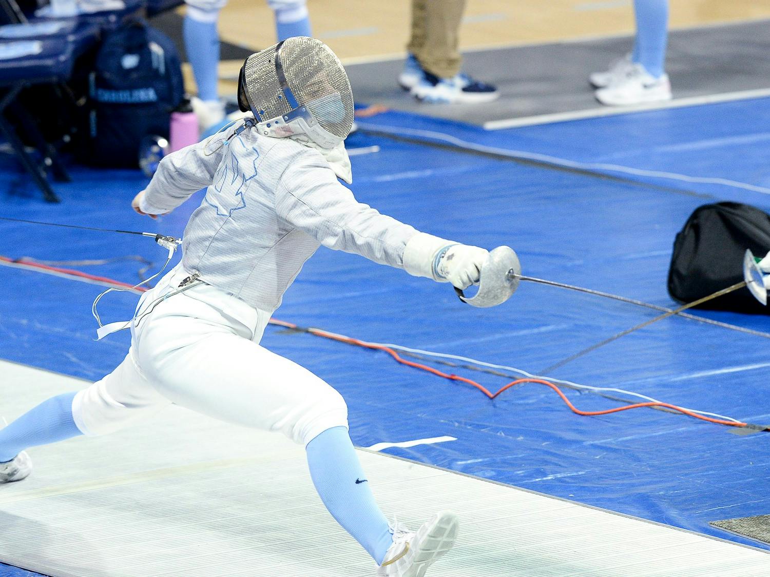 Abigale Parker fences during the  ACC Championship in Carmichael Arena on Sunday, Feb. 28, 2021.
Photo Courtesy of Jeffrey Camarati/UNC Women's Fencing.
