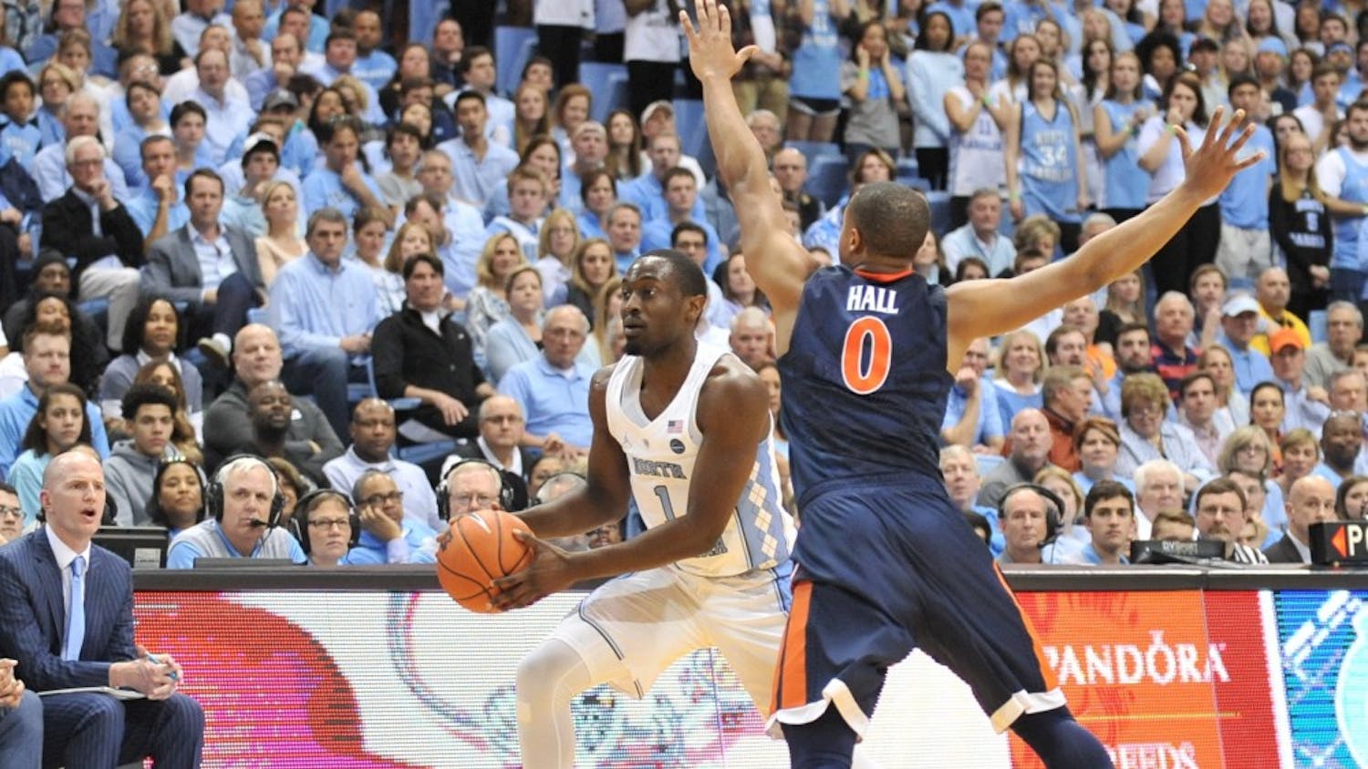 North Carolina wing Theo Pinson (1) looks for an open pass around a defender from UVA during the game on Feb. 18.&nbsp;