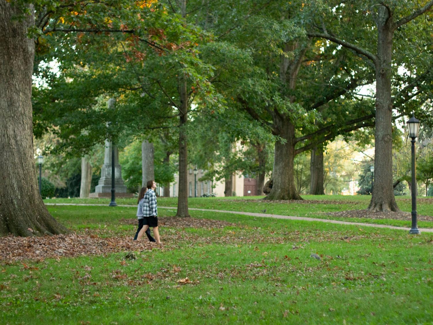 UNC students stroll through McCorkle place on North Campus on Tuesday, Oct. 27th, 2020.