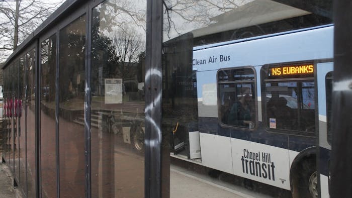 Rust, graffiti and debris plague the bus stop across from Fraternity Court on Tuesday, Jan. 29, 2019. Bus stops all around the town of Chapel Hill have been victims of neglect and signs have begun to show.