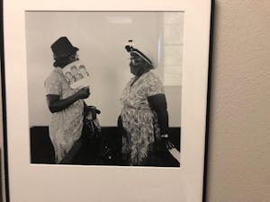 A photo titled "Women talking after church service at Hunter Chapel Missionary Baptist Church, 1971." The photo is part of the exhibit of Cheryl Thurber photos being hosted by Wilson Library, detailing musical traditions in Gravel Springs, Mississippi.&nbsp;