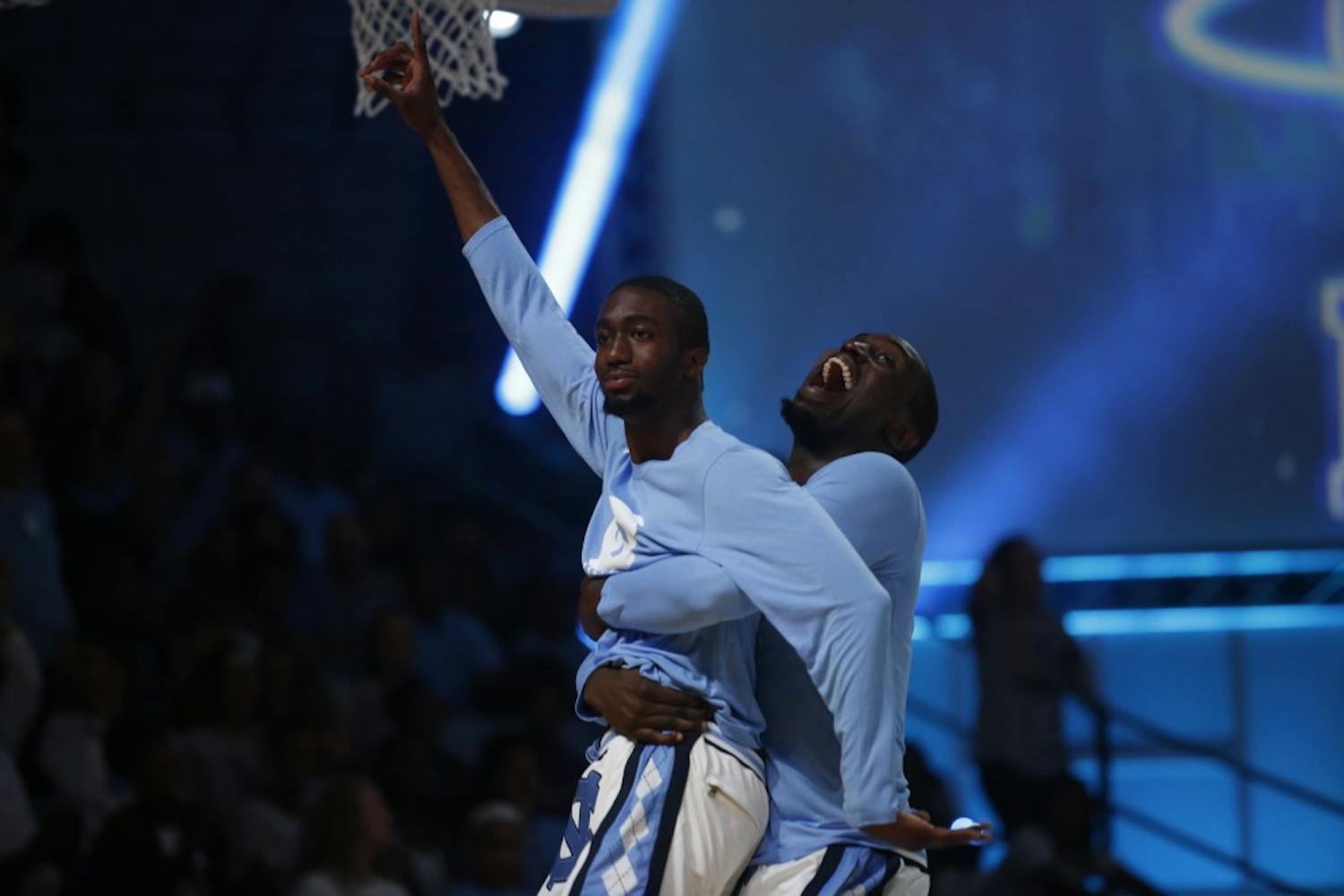 Brandon Robinson celebrates with Theo Pinson after hitting a shot during Late Night With Roy on Friday night.