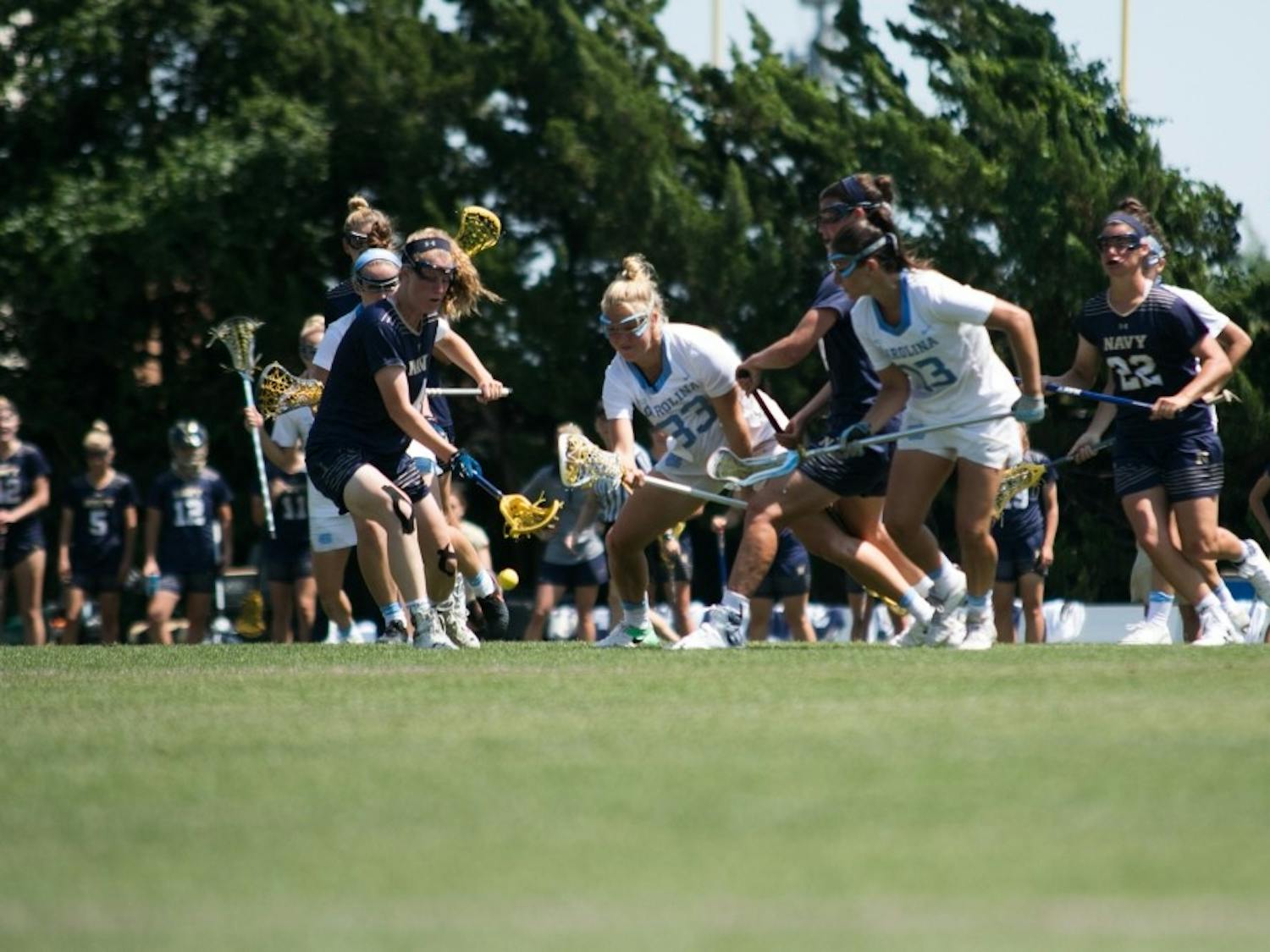 North Carolina and Navy players fight for the ball during a NCAA quarterfinal match on May 20, 2017, at Fetzer Field.