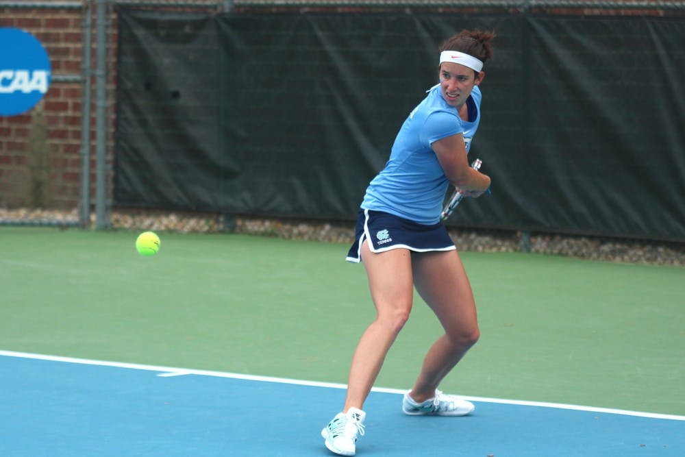 Tessa Lyons focuses on the ball during the second round of the NCAA women's tennis tournament Saturday afternoon. 