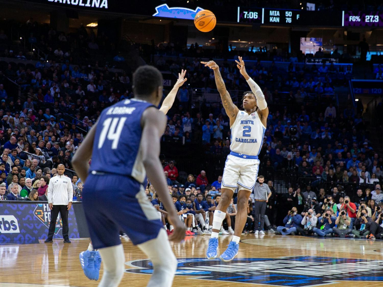 Sophomore guard Caleb Love (2) shoots a three at the Elite 8 game of the NCAA tournament against St. Peter's at the Wells Fargo Center in Philadelphia. UNC won 69-49 and is advancing to the Final Four. &nbsp;&nbsp;