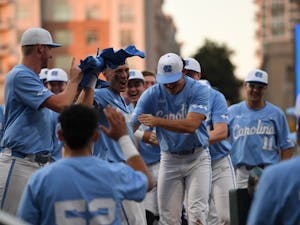 Junior shortstop Danny Serretti (1) celebrates with his teammates after hitting a home run in UNC's game against Virginia Tech at Truist Field in Charlotte, N.C. on May 28, 2022. UNC won 10-0 to advance to the ACC Tournament semifinals. Photo courtesy of ACC Media.