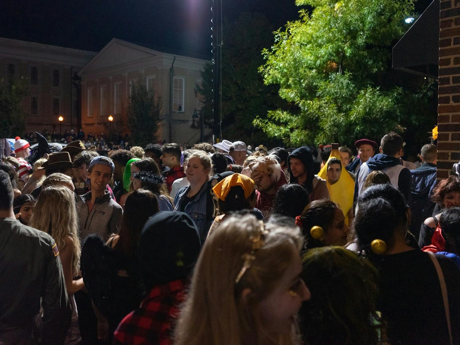 Students, families and community members gather on the sidewalks of Franklin Street on Halloween night, Oct. 31, 2021. 