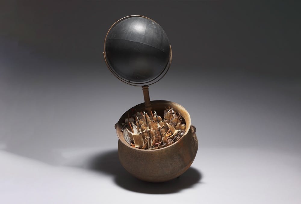 <p>Lonnie Holley, American, born 1950, What Was Beyond Us (The Ocean of Our Thoughts), 2019, globe and stand, model ships, rocks, earth, moss, and cast iron pot, 40 1/2 x 19 in. (102.9 x 48.3 cm). Ackland Art Museum, University of North Carolina at Chapel Hill. Promised gift of John A. Powell, '77, L2020.10.1a-o. © 2022 Lonnie Holley / Artists Rights Society (ARS), New York.</p>
<p>Photo Courtesy of Ackland Art Museum.</p>