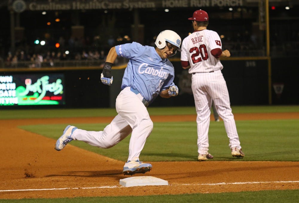 Outfielder Tyler Ramirez (14) rounds third base during No. 13 UNC baseball team’s 15-0 rout of No. 7&nbsp;South Carolina at BB&T BallPark in Charlotte on Wednesday.