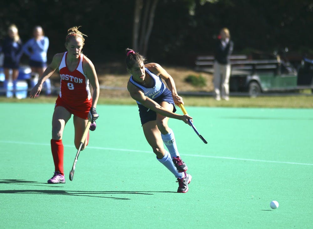 Wold, Emily passes the ball at the field hockey game against Boston University on Saturday Nov. 14 