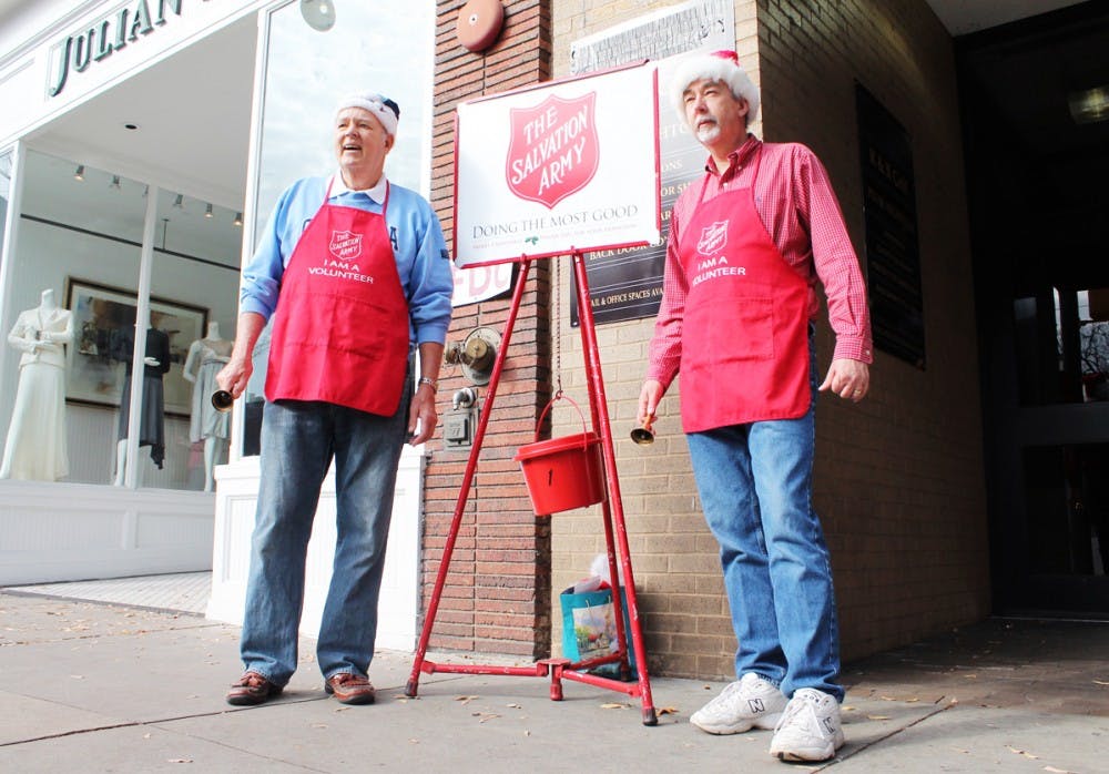 Salvation Army canvases on Franklin Street.LEFT TO RIGHTJohn Sehon, RetiredPhilip Hughes, Chemist at Duke
