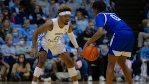 Redshirt sophomore guard Anthony Harris (0) guards a UNC Asheville player at the game on Tuesday, Nov. 23, 2021, at the Dean E. Smith Center. UNC won 72-53.