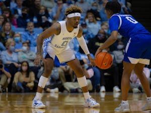 Redshirt sophomore guard Anthony Harris (0) guards a UNC Asheville player at the game on Tuesday, Nov. 23, 2021, at the Dean E. Smith Center. UNC won 72-53.