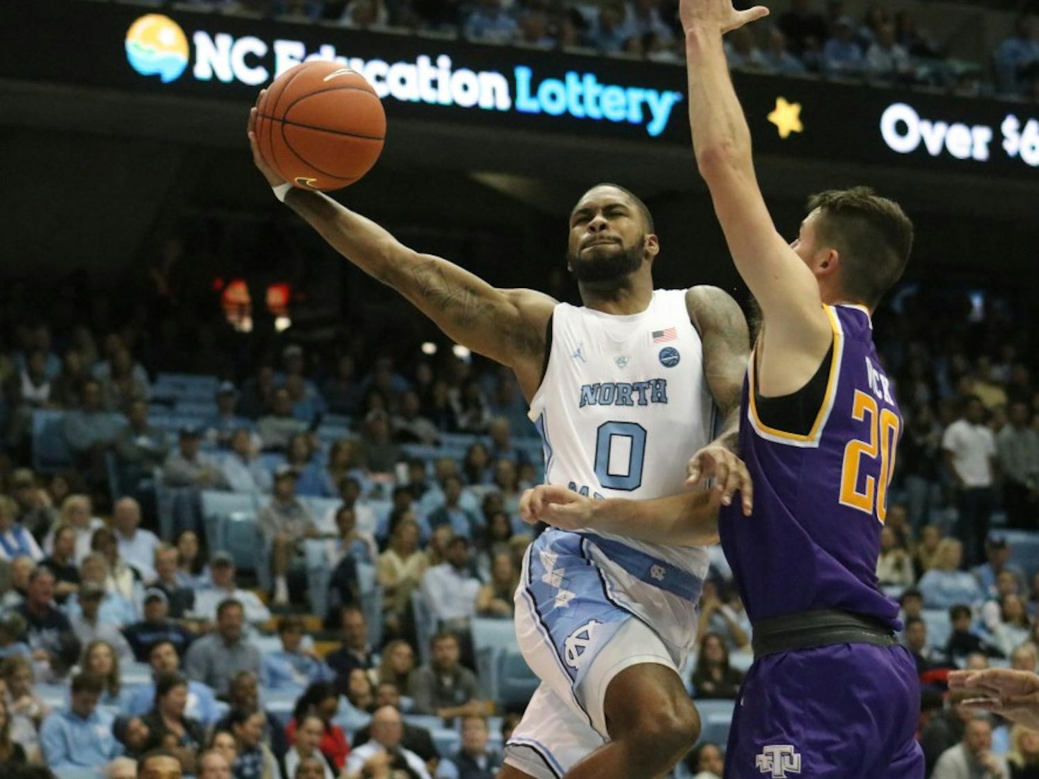 UNC guard Seventh Woods (0) uses his full wingspan in a scoring drive against Tennessee Tech on November 18th in the Dean Dome.