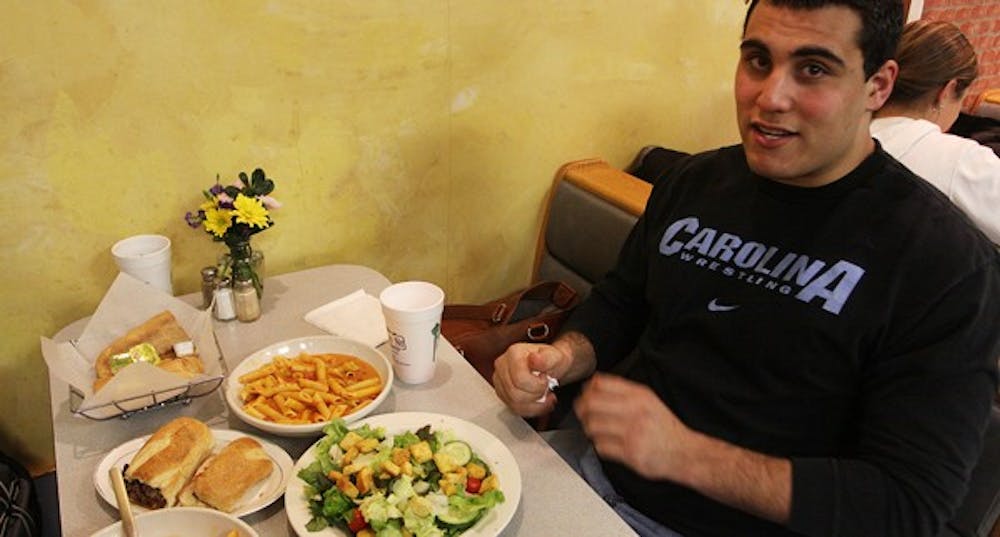 UNC heavyweight wrestler Ziad Haddad orders “the usual” at Franklin Street Pizza & Pasta. DTH/Margaret Cheatham Williams 