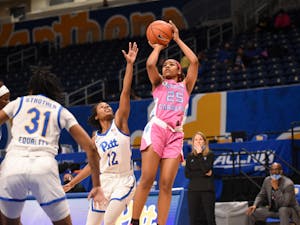 UNC first year guard Deja Kelly (25) attempts to make a shot during a game against Pitt on Sunday, Feb. 14, 2021. UNC beat Pitt 81-72. Photo courtesy of Matthew Hawley. 