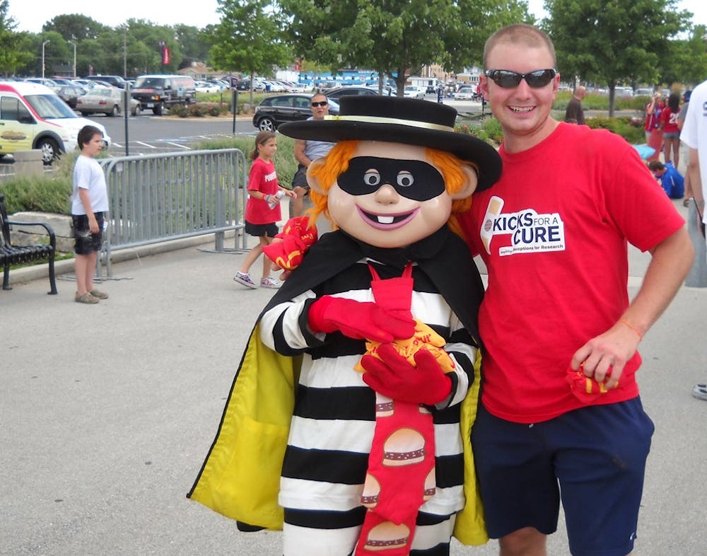 Chase Jones, an Eve Carson Memorial Scholarship winner, stands with the Hamburglar. He used part of his scholarship to help the Ronald McDonald House suring an internship in Chicago.        
