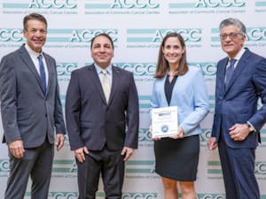 From left: Christian Downs, ACCC Executive Director; Ali McBride, ACCC President; Suzanne Francart, UNC Hospitals Department of Pharmacy, Assistant Director of Pharmacy; and Randall Oyer, ACCC President-Elect. The UNC Hospitals Department of Pharmacy received the 2019 Innovator award for a system that reduces financial risk for the hospital and its patients. Photo courtesy of Suzanne Francart.