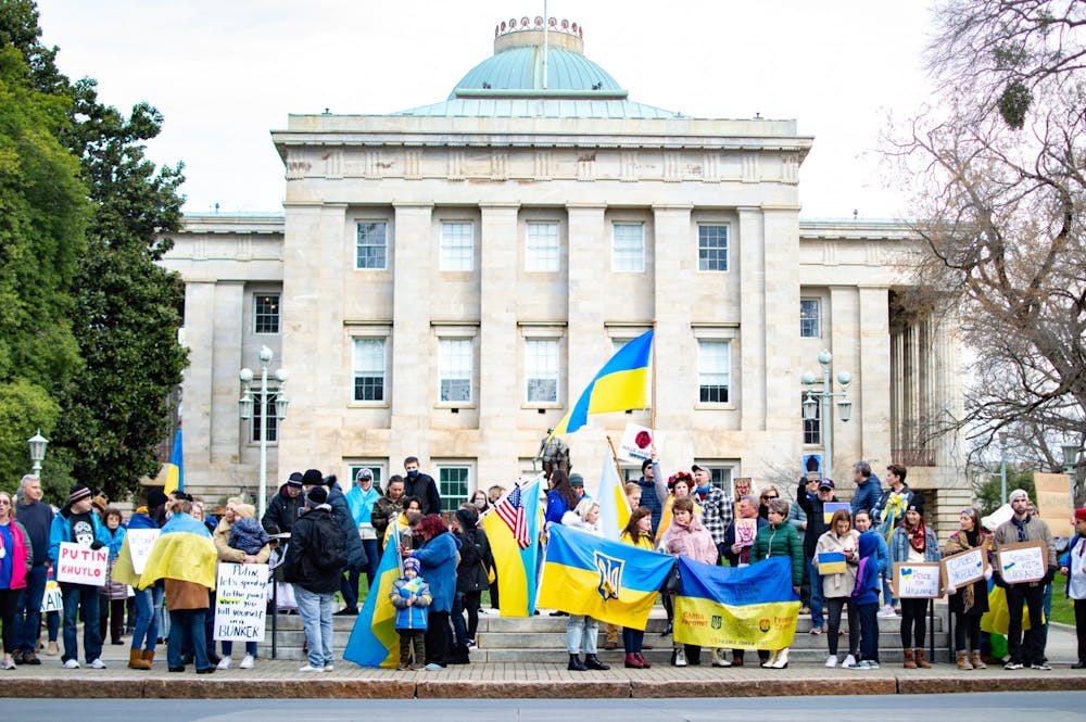 <p>People gather outside of the North Carolina State Capitol building in Raleigh, N.C. for a march in support of Ukraine on Feb. 26, 2022.</p>