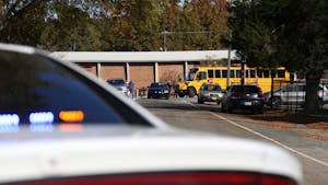 Students from Carrboro Elementary school are bused to Carrboro Town Hall, where parents could check out their kids, on Tuesday Nov. 20 after an active shooter false alarm at the school. The police found no substance to the active shooter call.&nbsp;
