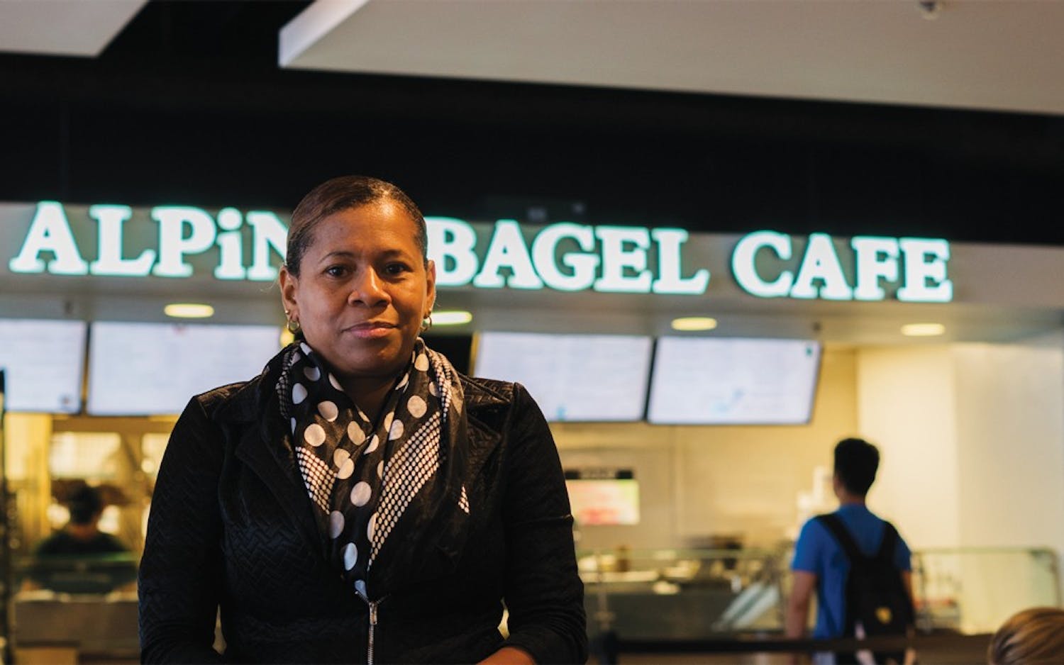 Lezlie Sumpter, a former employee of Alpine Bagel Cafe in the Student Union, poses in front of the storefront. Sumpter believes she was wrongfully fired.