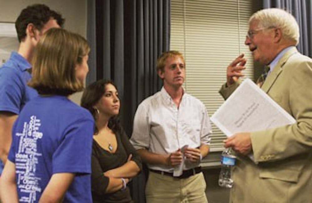 Congressman David Price speaks to students after giving a speech about health care in Wilson Library Wednesday.