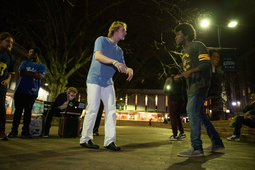 Michael "Lord Goose" Seethaler and Justis "Justis Ryan" Malker, members of the weekly freestyle group Cypher, rap-off in the Pit at UNC-Chapel Hill on January 15, 2020. “We don’t care if you’re Jay-Z or if you don’t even consider yourself a good rapper,” he said. “Like, there are times where the mission is not to be good. The mission is to be real, to be authentic.”