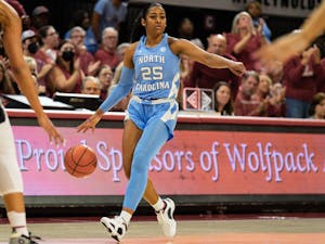 UNC junior guard Deja Kelly (25) calls a play during the women’s basketball game against NC State on Thursday, Feb. 16, 2023, at Reynolds Coliseum in Raleigh, NC. UNC fell to N.C. State 66-77.