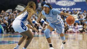 Former UNC junior guard Kennedy Todd-Williams (3) moves toward the basket during the women’s basketball game in the third round of the ACC tournament in Greensboro, N.C., on Friday, March 3, 2023. UNC fell to Duke 40-44.