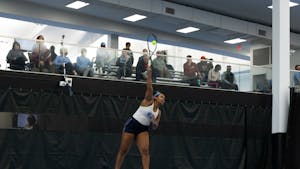 Graduate Abbey Forbes hits the ball during the UNC match against Elon at the Cone-Kenfield Tennis Center on Friday, January 13, 2023. UNC beat Elon 4-2.