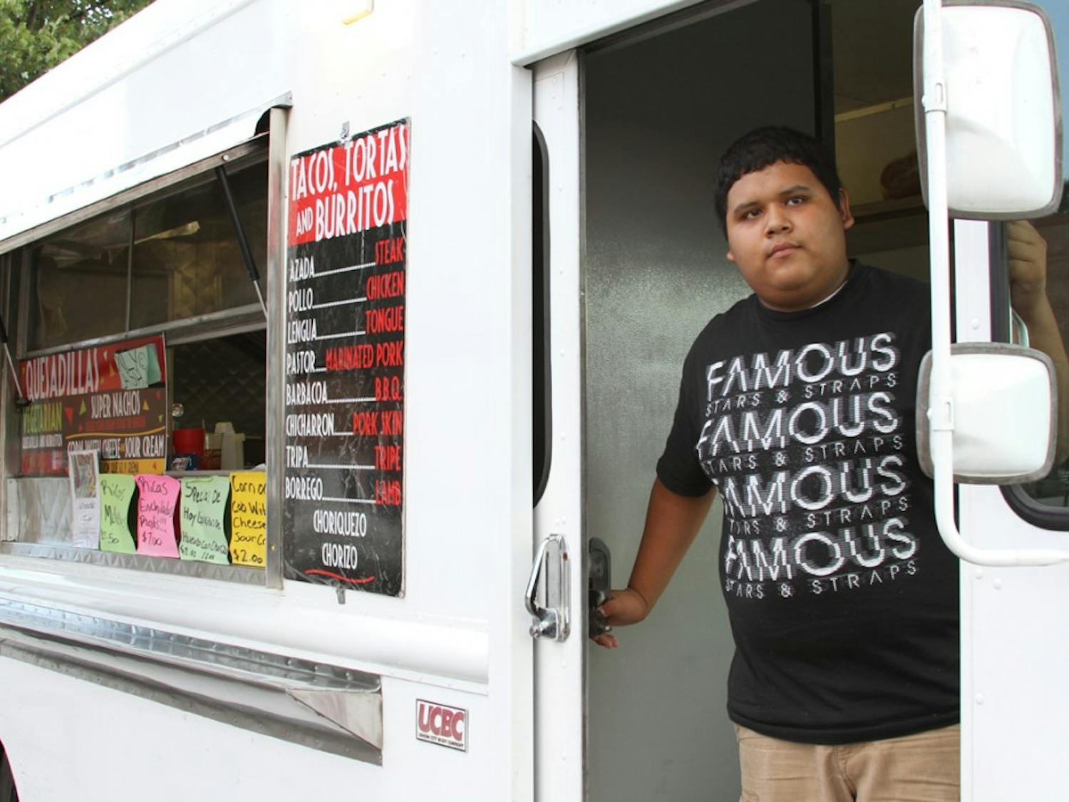 Roberto Garcia, 17, of Burlington works at the Taqueria Del Jalisco food truck located at 206 E. Main Street. The truck is open from 6pm-1am Tuesday to Saturday for late-night taco cravings.