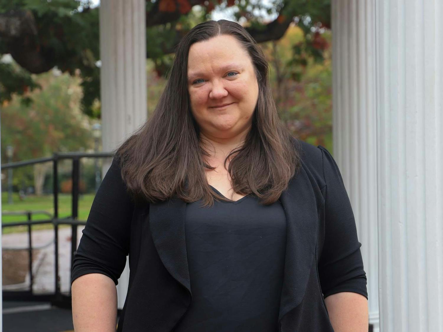 UNC Professor, Dr. Rebecca Kreitzer, poses by the Old Well on Wednesday, October 25, 2022. Dr. Kreitzer created a website designed to help students learn how to vote.