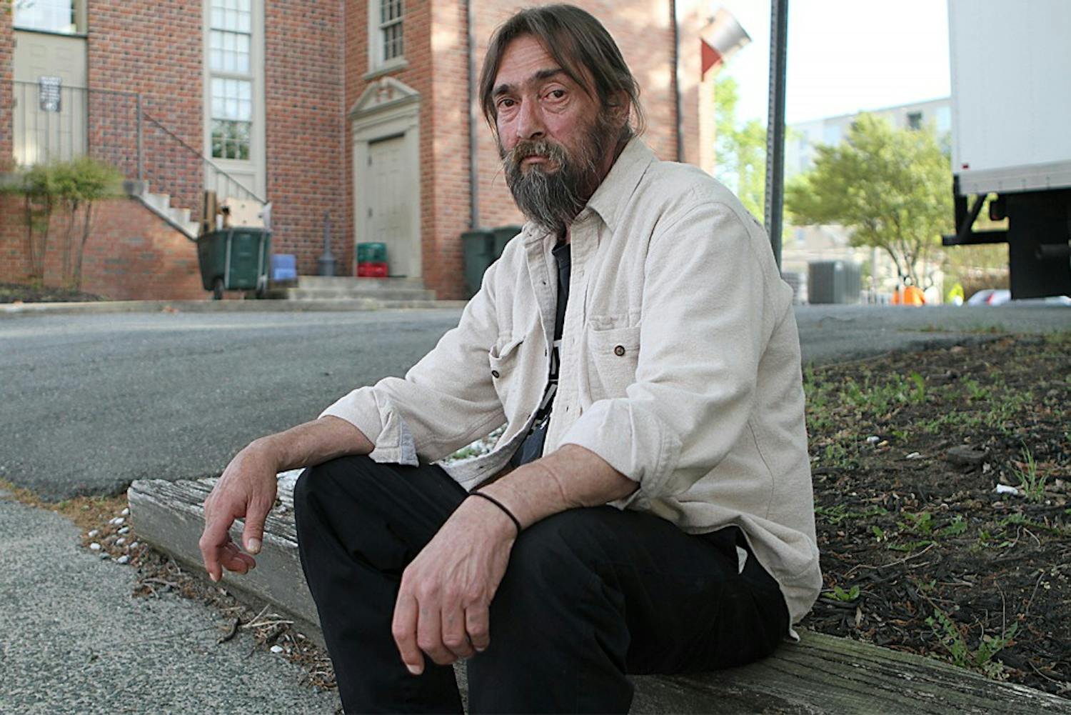 Tommy Keeter sits outside the IFC, a local homeless shelter located on Rosemary Street. Keeter says the IFC has several services available for the homeless, including medical and psychiatric care.