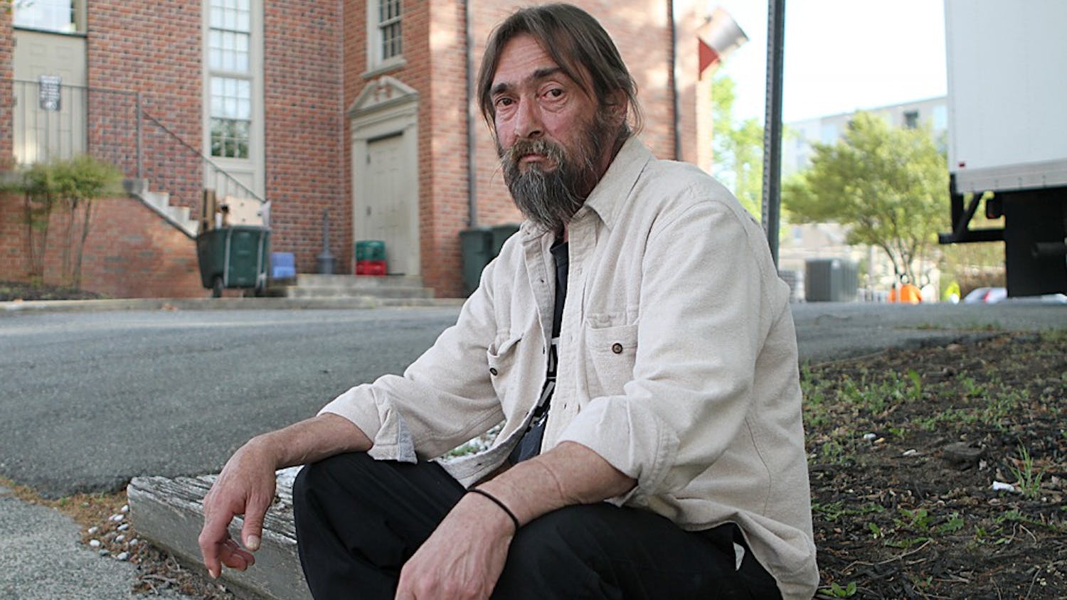 Tommy Keeter sits outside the IFC, a local homeless shelter located on Rosemary Street. Keeter says the IFC has several services available for the homeless, including medical and psychiatric care.