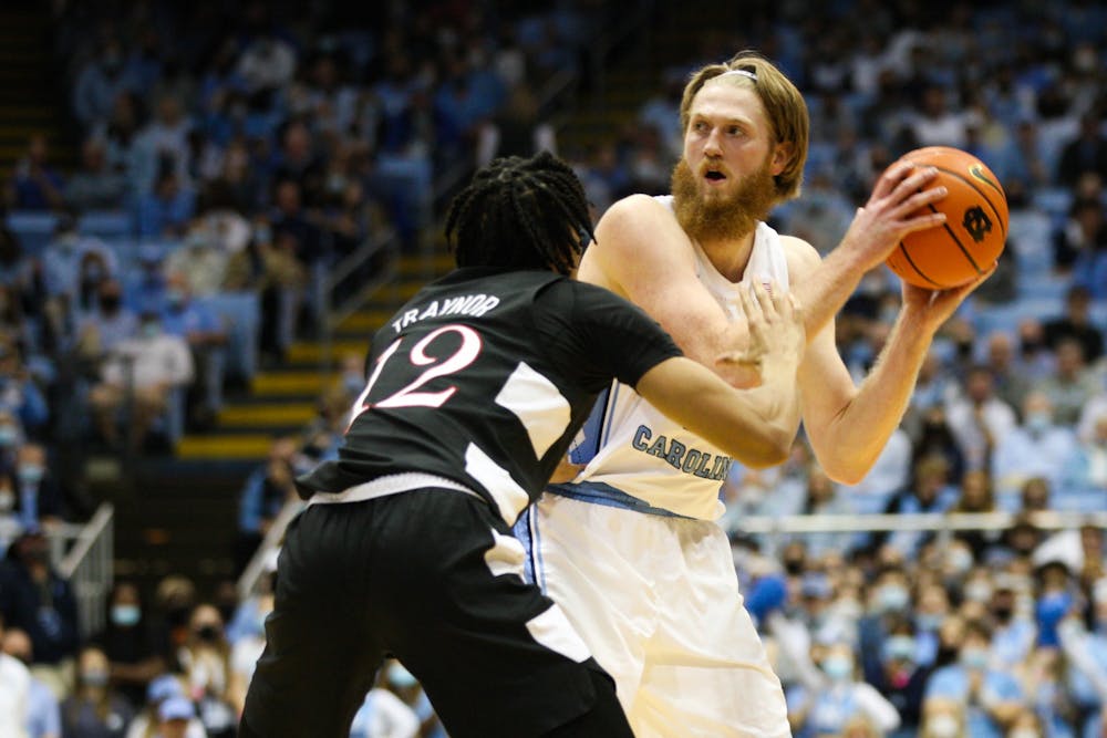 UNC graduate forward Brady Manek (45) looks for a clear pass during a home men's basketball game against Louisville on Monday, Feb. 21, 2022. UNC won 70-63.