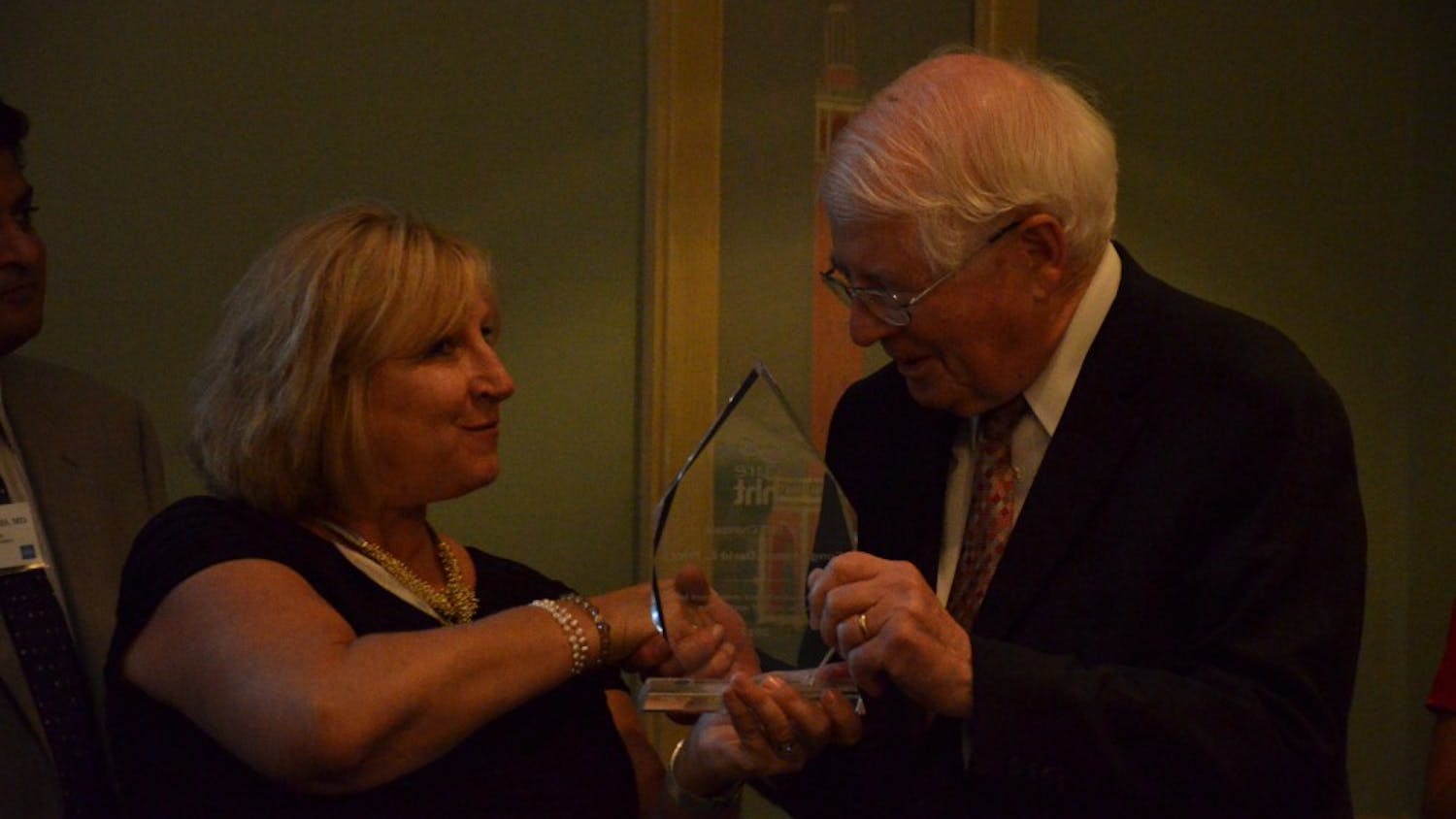 Executive Director of Cure HTT, Marianne S. Clancy, presents Congressman David Price an award on behalf of Cure HTT in August for his work in passing legislation on behalf of those affected by the genetic disease. Price, along with Gov. Roy Cooper, opposed the the proposed Republican health care bill.&nbsp;
