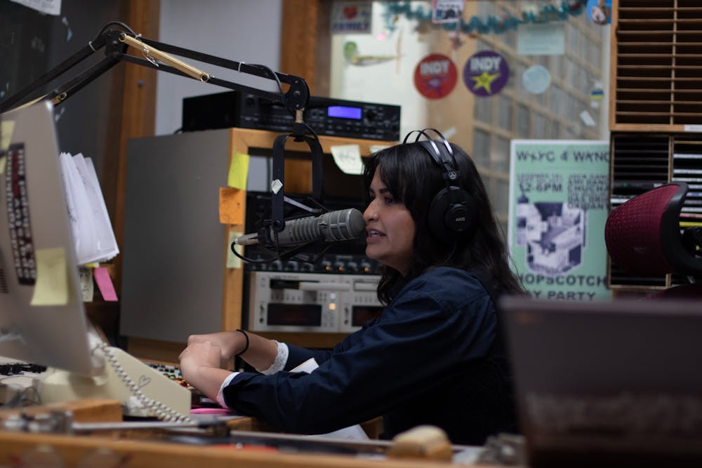 <p>Ashley Choo-Hen, a senior classics and english major, provides commentary on the music being played during one of her DJ sets at WXYC. WXYC is celebrating the 25th anniversary of being the first radio station to live stream a program over the internet on Wednesday, Nov. 13, 2019.&nbsp;</p>