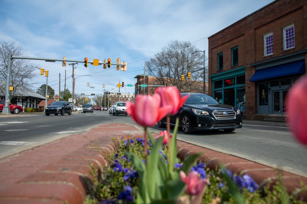<p>Cars pass between Main and Weaver Streets in Carrboro Tuesday, March 29, 2022.&nbsp;</p>