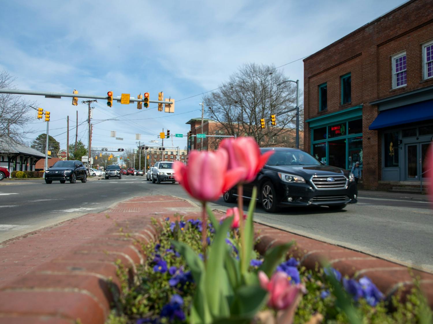 Cars pass between Main and Weaver Streets in Carrboro Tuesday, March 29, 2022.&nbsp;