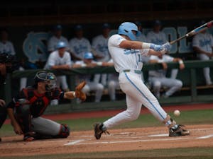 UNC baseball junior and 1B, Michael Busch (15), swings and misses the ball during the first game of the super regionals versus Auburn on Saturday June 8, 2019. Auburn beat UNC 11-7.