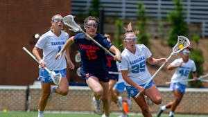 Senior midfielder Brooklyn Neumen (35) carries the ball down the field during UNC's NCAA Tournament second round match against Virginia at Dorrance Field on Sunday, May 15, 2022.