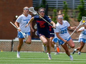 Senior midfielder Brooklyn Neumen (35) carries the ball down the field during UNC's NCAA Tournament second round match against Virginia at Dorrance Field on Sunday, May 15, 2022.