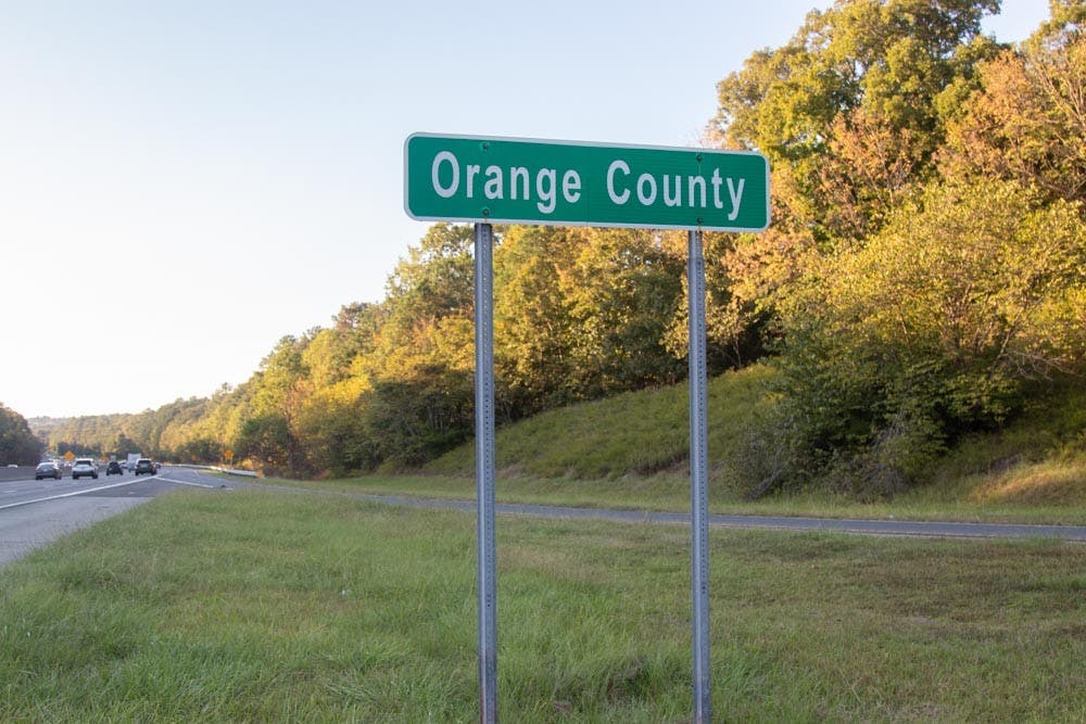 An Orange County sign is pictured on Interstate 40 on Oct. 13, 2021. On Oct. 8, Orange County launched a new Longtime Homeowner Assistance to provide property tax bill assistance to homeowners who have lived in Orange County for over 10 years.