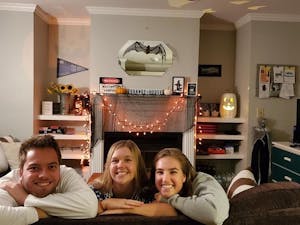 (from left) Jacob Messer, Kayley Carpenter and Elizabeth Wheless in their living room filled with Halloween decorations as they prepare to celebrate the holiday. Photo courtesy of Elizabeth Wheless.
