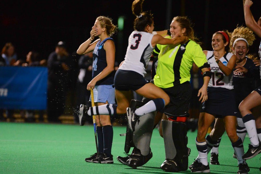 UNC forward Emma Bozek (14) reacts after missing an open net penalty shot to prolong the game. 