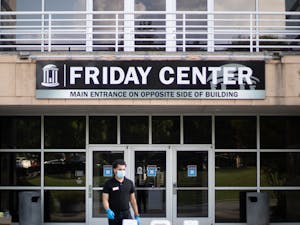 Alberto Rivera, set-up coordinator for the Friday Center exits the building on Tuesday, Aug. 11, 2020. Some classes have been moved to the Friday Center for the Fall 2020 semester to promote social distancing, but the change has created transportation problems for some students.