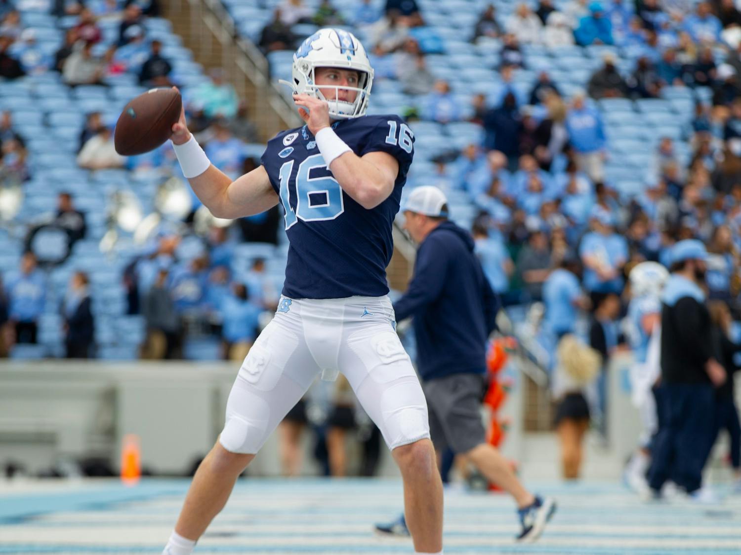 Russell Tabor (16), redshirt freshman quarterback, warms up before UNC football's spring scrimmage in Chapel Hill, NC, on April 9, 2022.