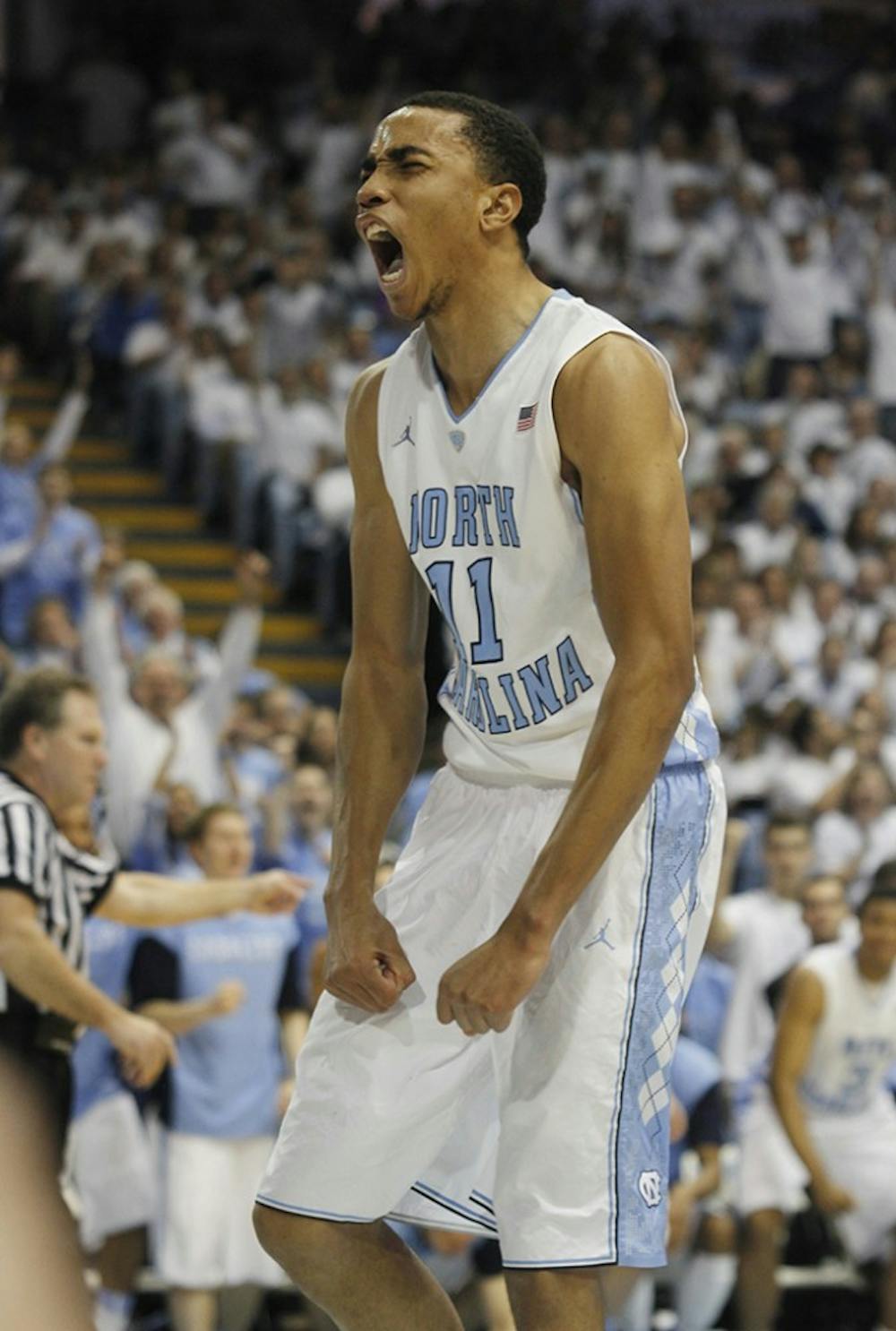 UNC forward Brice Johnson (11) reacts after scoring a basket despite a foul. Johnson finished the game with 13 points and 5 blocks.