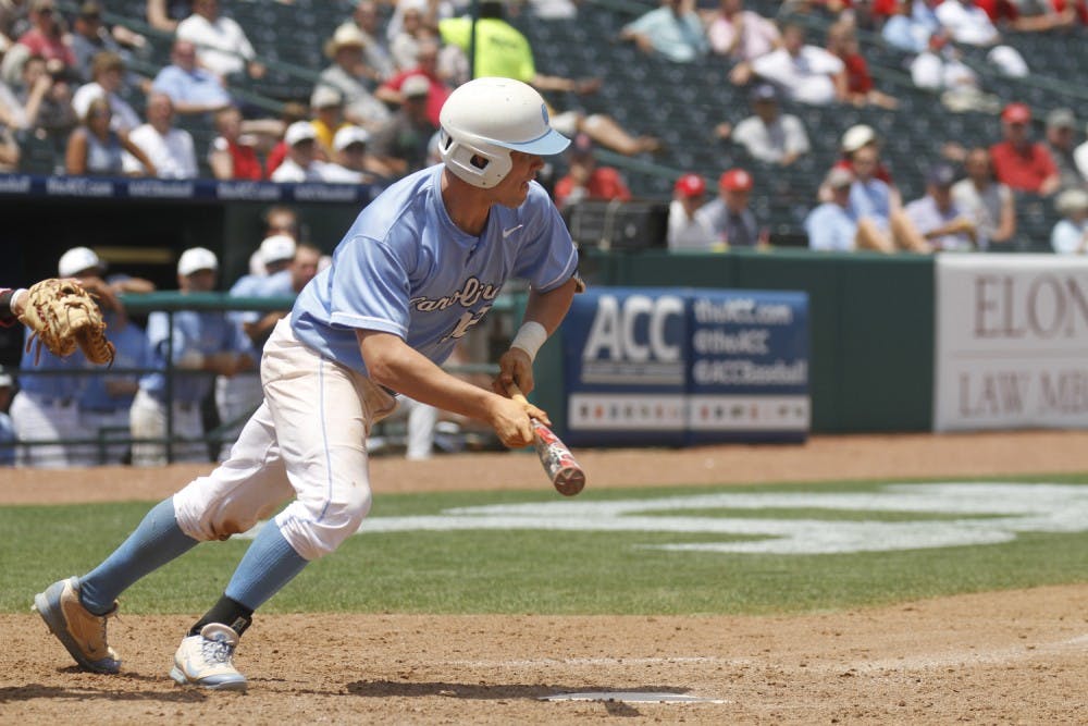 Landon Lassiter runs out of the batter's box after laying down a bunt. 